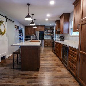 Kitchen-with-wood-cabinets-new-white-granite-counter-tops-and-lighting